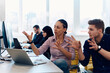 © .shock - Collaborative process of multicultural skilled young business team during brainstorming meeting in office.Diverse group of young people dressed in formal wear cooperating on developing design project