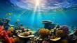 Underwater panorama of a tropical coral reef with fishes and sunlight