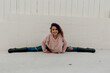 © Erin Brant/Stocksy - Tween girl does split