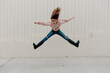 © Erin Brant/Stocksy - Portrait of young girl jumping