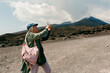 © Jimena Roquero/Stocksy - Tourist taking pictures in mount Etna