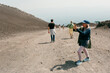 © Jimena Roquero/Stocksy - Tourist taking pictures in mount Etna