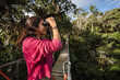 © Luis Herrera/Stocksy - woman enjoying ecotourism and bird watching