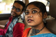 © Dream Lover/Stocksy - Young couple interacting inside a car wearing traditional Indian dress