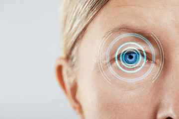 Sticker - Vision test. Mature woman and digital scheme focused on her eye against white background, closeup