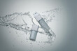 © Marc Tran/Stocksy - White cosmetic products with water splash on gray background.
