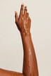 © Anna Tabakova/Stocksy - Oil dripping down woman's arm