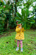 © Gemma can fly/Stocksy - Nature lover kid playing in Costa Rica rainforest. travel ugc