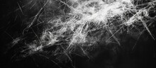 A Black And White Collage Featuring A Bunch Of Hair Strands In Various Directions, Torn And Placed Against A Textured Background Of Crumpled Paper.