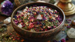 A bowl filled with a mixture of crushed herbs and crystals ready to be used in a healing bath or cleansing ritual.