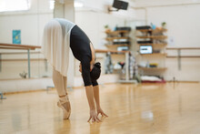 Woman In Ballet Costume Dancing Gracefully In Studio