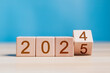 © Pakin - 2025 growth business. wooden block with 2024 change to 2025, Set up objective target business cost and budget planning for new year concept