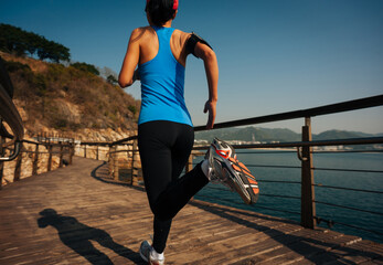 Poster - Healthy lifestyle sports woman running on wooden boardwalk seaside