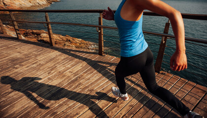 Poster - Healthy lifestyle sports woman running on wooden boardwalk seaside