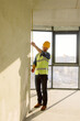 © Oleksii Syrotkin/Stocksy - Building Worker Determines Wall Size Renovating Flat