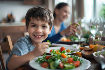 Small kid eats salad while having family lunch at dining table at home, healthy food concept