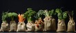 A row of burlap bags filled with a variety of fresh vegetables including carrots, cabbages, avocados, and foliage, neatly placed on top of a wooden table.