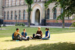 © Oleksii Syrotkin/Stocksy - Faculty classmate education seeker friend meeting uni campus interact