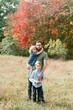 © Serena Burroughs/Stocksy - happy young dad holding his children