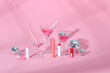 © Marc Tran/Stocksy - Make up products prsented on pink podiums on pink pastel background.