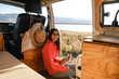 © Luis Herrera/Stocksy - travel with a pet, van life concept