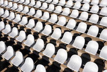 Empty white seats in a stadium