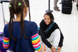 © Anya Brewley Schultheiss/Stocksy - Child sitting on an airport floor while tying her shoe