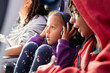 © Anya Brewley Schultheiss/Stocksy - Child on an airline flight adjusting her headphones