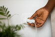 © Studio Firma/Stocksy - Woman Putting Plug Into Socket