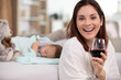 © auremar - young mum holds a glass of wine while baby sleeps