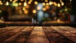 Wooden table with blurred background of restaurant light bokeh.