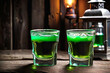 Drinks for St. Patrick's Day party. Shot cocktail on background of a pub. St. Patrick's day.