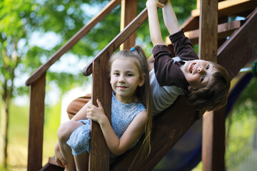 Wall Mural - Children walk in the summer in nature. Child on a sunny spring morning in the park. Traveling with children.