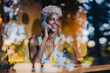© VICTOR TORRES/Stocksy - Cheerful black woman talking on smartphone
