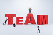 © Who is Danny - Creative image of businesspeople with red team word concept on white backdrop. Teamwork and partnership concept.