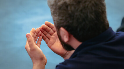 Religious muslim man praying inside the mosque