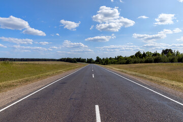 Wall Mural - paved road along and blue sky