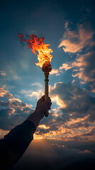 Poster - Glorious hand holds flaming torch against cloudy sky, Paris 2024. 