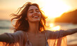Backlit Portrait of calm happy smiling free woman with open arms and closed eyes enjoys a beautiful moment life on the seashore at sunset 