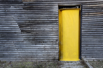 Wall Mural - Ancient closed doorway  in wooden wall made from lapped boards. Antique wooden door. exterior of old house, background of home surface.