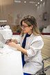 © Lupe Rodríguez/Stocksy - sewing workshop of a fashion designer