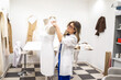 © Lupe Rodríguez/Stocksy - sewing workshop of a fashion designer