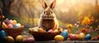 A cute rabbit is sitting inside a basket filled with colorful Easter eggs, including one large chocolate egg. The rabbit appears curious and content as it explores its surroundings.