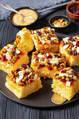 Wall Mural - slices of yogurt cake with nuts and dried berries