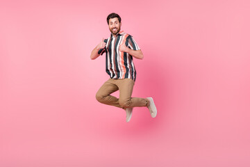 Sticker - Full body length photo of mature age man positive jumping trampoline show double thumbs good rating isolated on pink color background