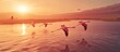 a group of flamingos flying over water