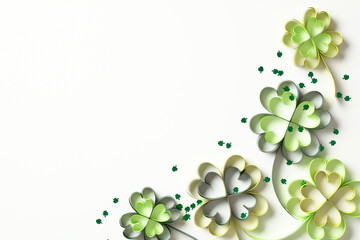 Wall Mural - St Patricks Day frame border of paper cut clover leaves and confetti on white background