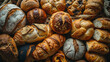 Different kinds of fresh bread as background, top view.