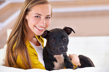 Canvas Print - Woman, dog and relax on sofa in portrait, smile for pet love and bonding at home with domestic canine. Happy, positive and trust with foster or adoption, cuddle puppy in living room and animal care