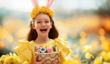 Fototapeta Tulipany - child with painting eggs outdoors